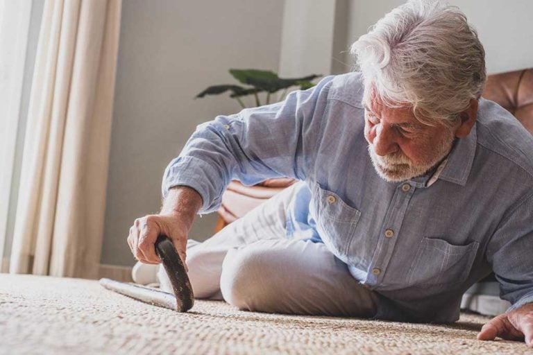 elder-senior-man-lying-on-floor-after-falling-down-768x512